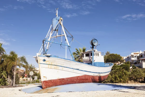 Old fishing boat in a roundabout in Spain — Stock Photo, Image