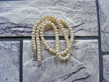 Strings of white pearl
