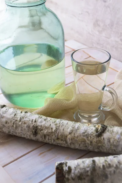 Birch juice. Traditional birch sap. A refreshing traditional russian spring drink. Vertical — стокове фото
