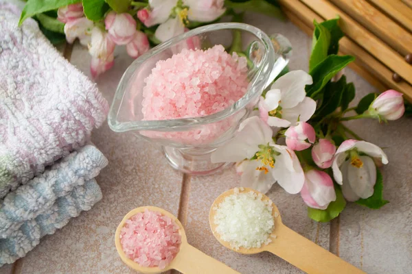 Beautiful composition of spa treatment on wooden background. Concept spa background with salt and cherry or apple flower — Stock Photo, Image