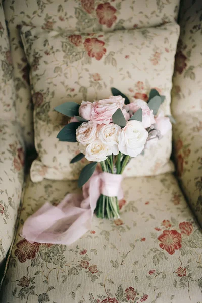 Wedding flowers with roses on an armchair