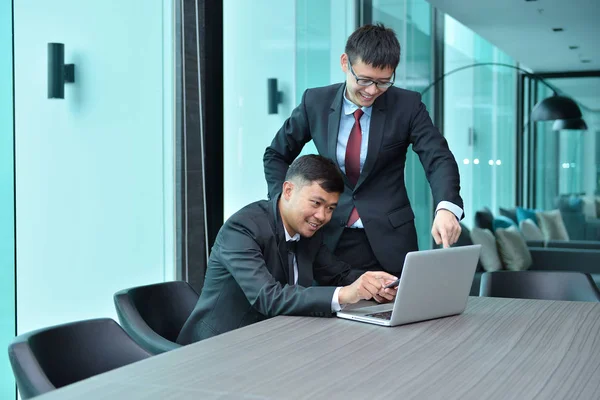 Asian Business people working together in front of laptop in mee