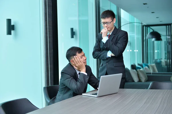 Asian Business people having trouble working, blaming at office