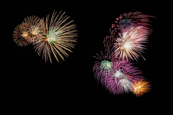 Variedade de fogos de artifício coloridos isolados no fundo preto — Fotografia de Stock