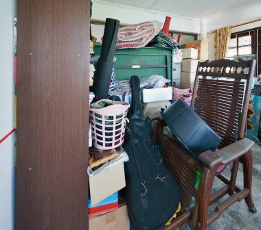 Messy storage room in garage for junk in old house clipart