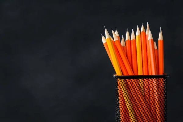 Book and pencil on white table black board background — Stock Photo, Image