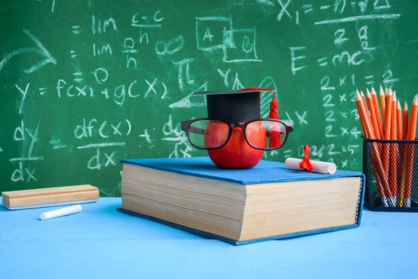Apple Knowledge Symbol and Pencil Books on the desk — Stock Photo, Image