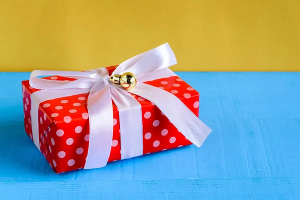 gift boxes on wood desk yellow wall background