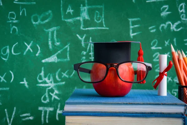 Apple Knowledge Symbol and Pencil Books on the desk — Stock Photo, Image