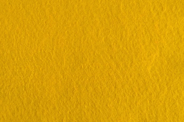 Textura natural de fieltro amarillo para fondo . — Foto de Stock