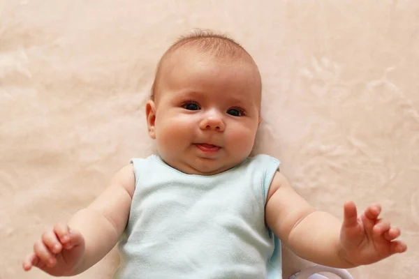 Portrait Smile Three Month Baby Blue Bodysuit Lying Beige Blanket — Stok Foto