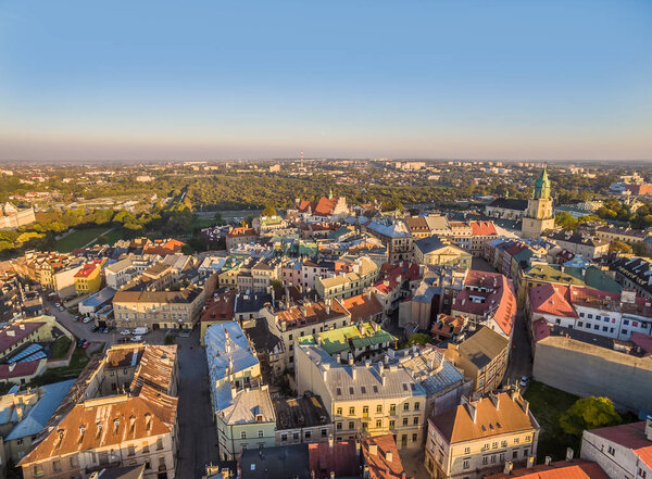 Lublin seen from the bird's eye view. Old town with visible Trinitarian tower and old Crown court in the evening sun.