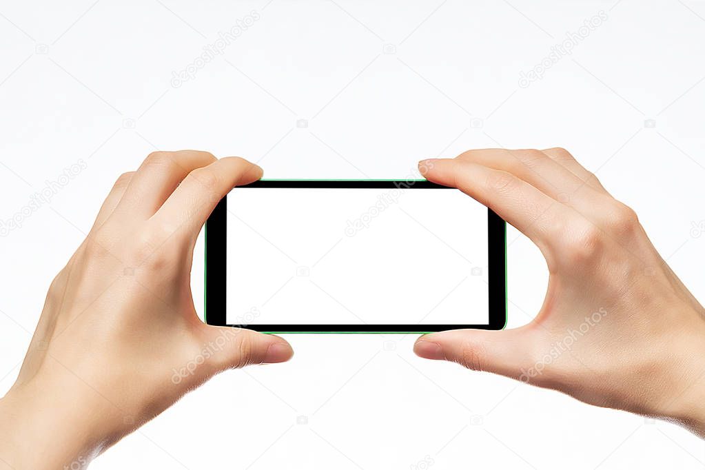 Mobile phone kept in both hands. Take photos of a smartphone.