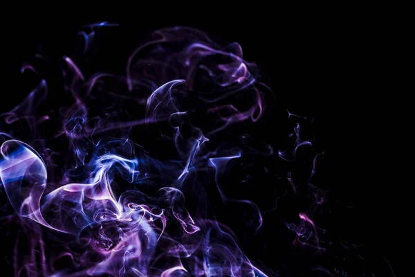 Duman - soyut renkli şekiller. Siyah arkaplan ve süslü şekiller. Duman - soyut renkli şekiller. Siyah arkaplan ve süslü şekiller.