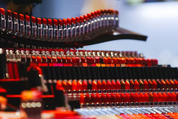 Red lipstick in the store. Selective focus image of lipstick in store with blurry bokeh background