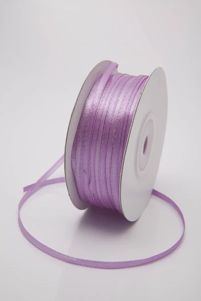 Pink-mauve color ribbon roll — Stock Photo, Image