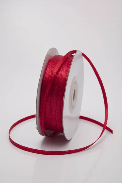 Ruby red color ribbon roll Stock Image