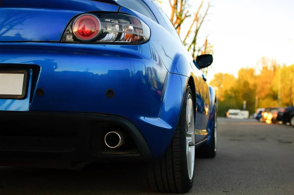 Back View of the Blue Sports Car Parked on the Street During Sunny Summer Day — Stock Photo, Image