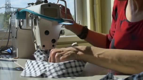Handmade mask sewing from the fabric is used to prevent dust and germs and viruses. Protection of Coronavirus Covid-19 during self-isolation concept — Stock Video