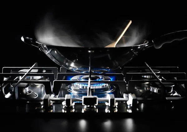 Wok pan on the flame — Stock Photo, Image