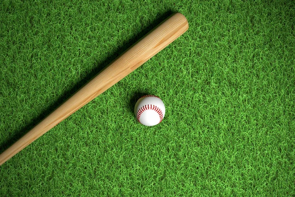 Honkbal en wodden vleermuis op gras — Stockfoto