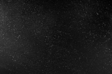 Soyut doku toz ve noktalar ışık ile. Siyah sesi glitter arka plan