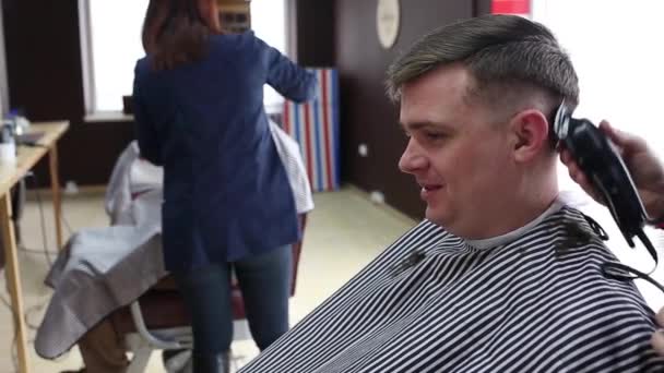 The Gay Boy Hairdresser Makes A Stylish Hairstyle For A Male