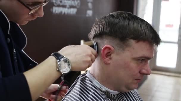 The Gay Boy Hairdresser Makes A Stylish Hairstyle For A Male