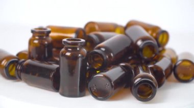 Medicine bottles on white background. Making tablets, pills and other medications. Pharmaceutical industry