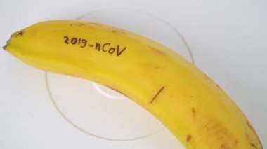 Banana with CORONAVIRUS text. Virus 2019-n CoV in Wuhan