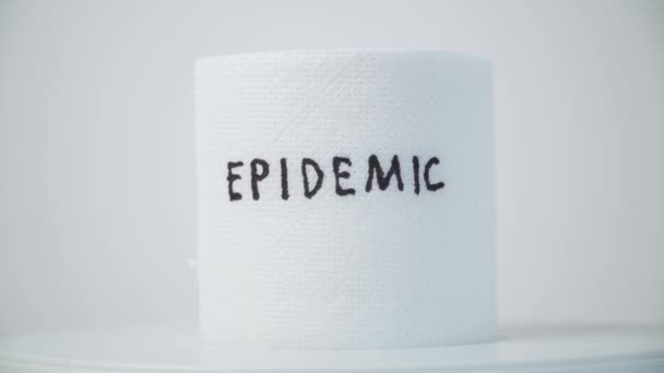 Toilet paper with text epidemic. Covid-19 concept, hygiene, panic — Stock Video