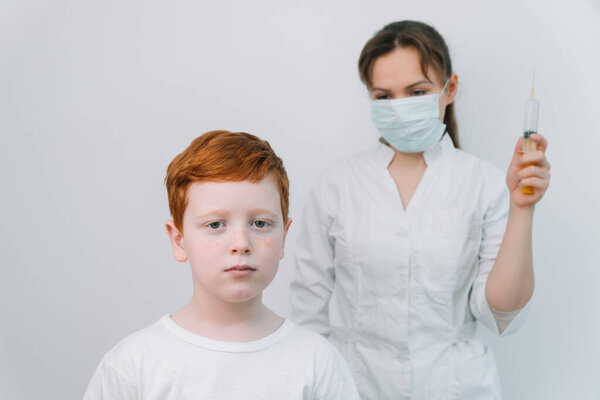 The doctor gives the child a flu shot Stock Image