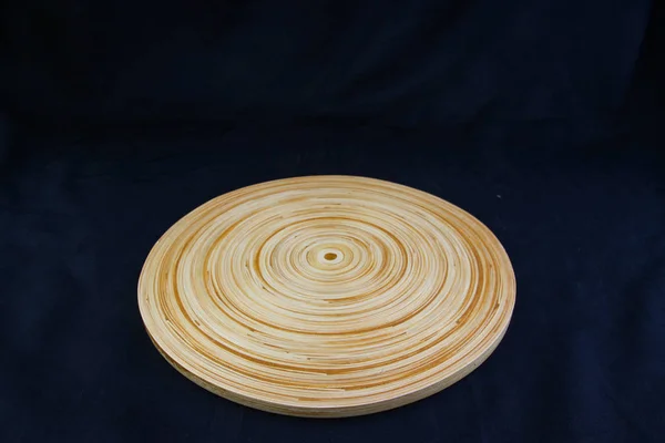 Isolate circle wood tray on black background, with work path.