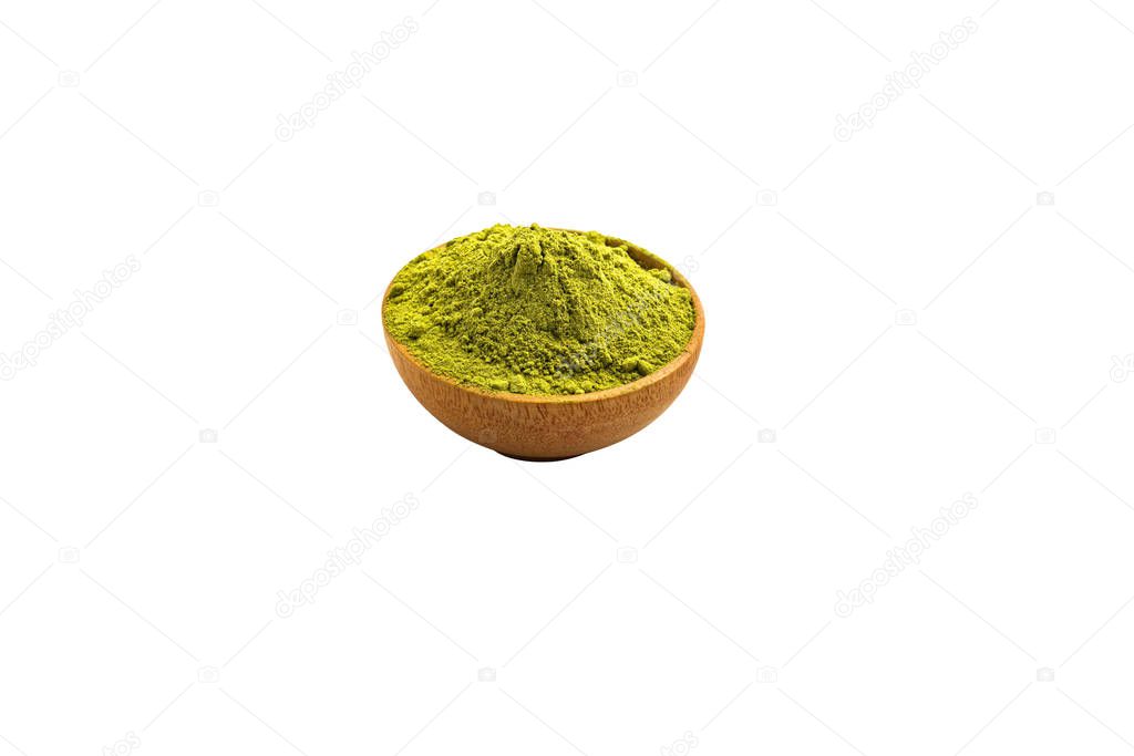 Isolate blended extract green tea powder in mini wooden bowl on white background. Top View.