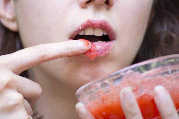 Strawberry lip scrub made at home to exfoliate lips