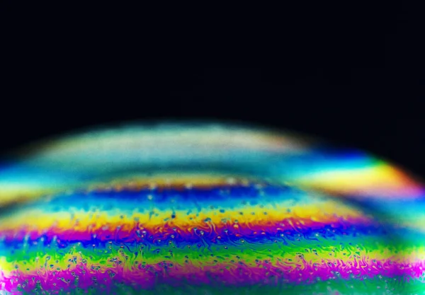 Macro on a soap bubble before it pops