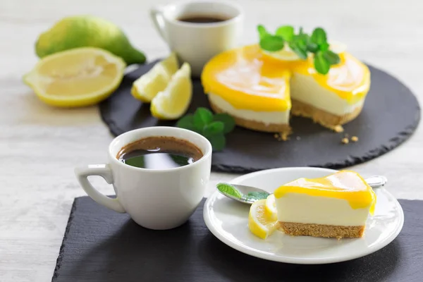 Creamy lemon cheesecake and coffee, a moment to enjoy the break