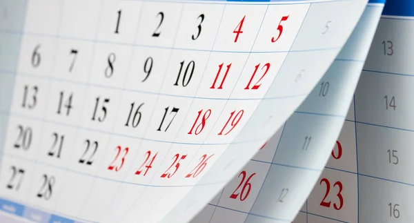Volteo de tres hojas de calendario con números negros y rojos — Foto de Stock