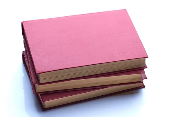Três livros interessantes vermelhos isolados no branco — Fotografia de Stock