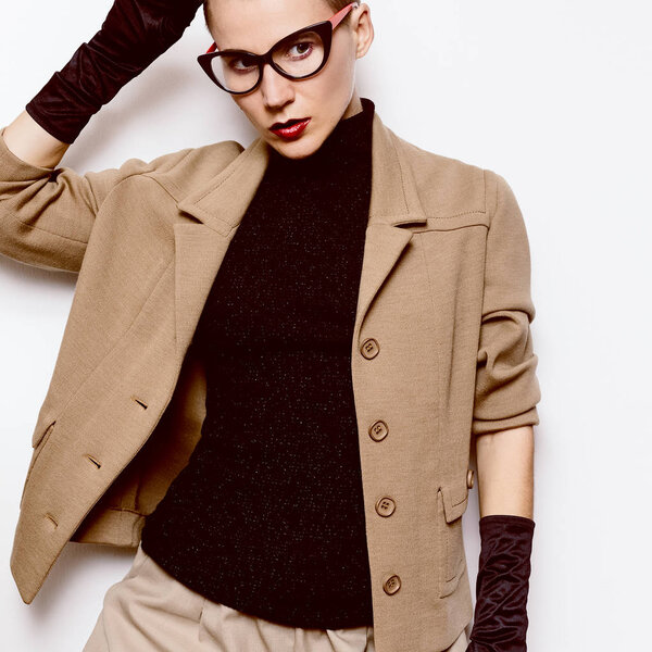 Vintage Fashion Woman Beige classic suit and stylish eyewear. Gl