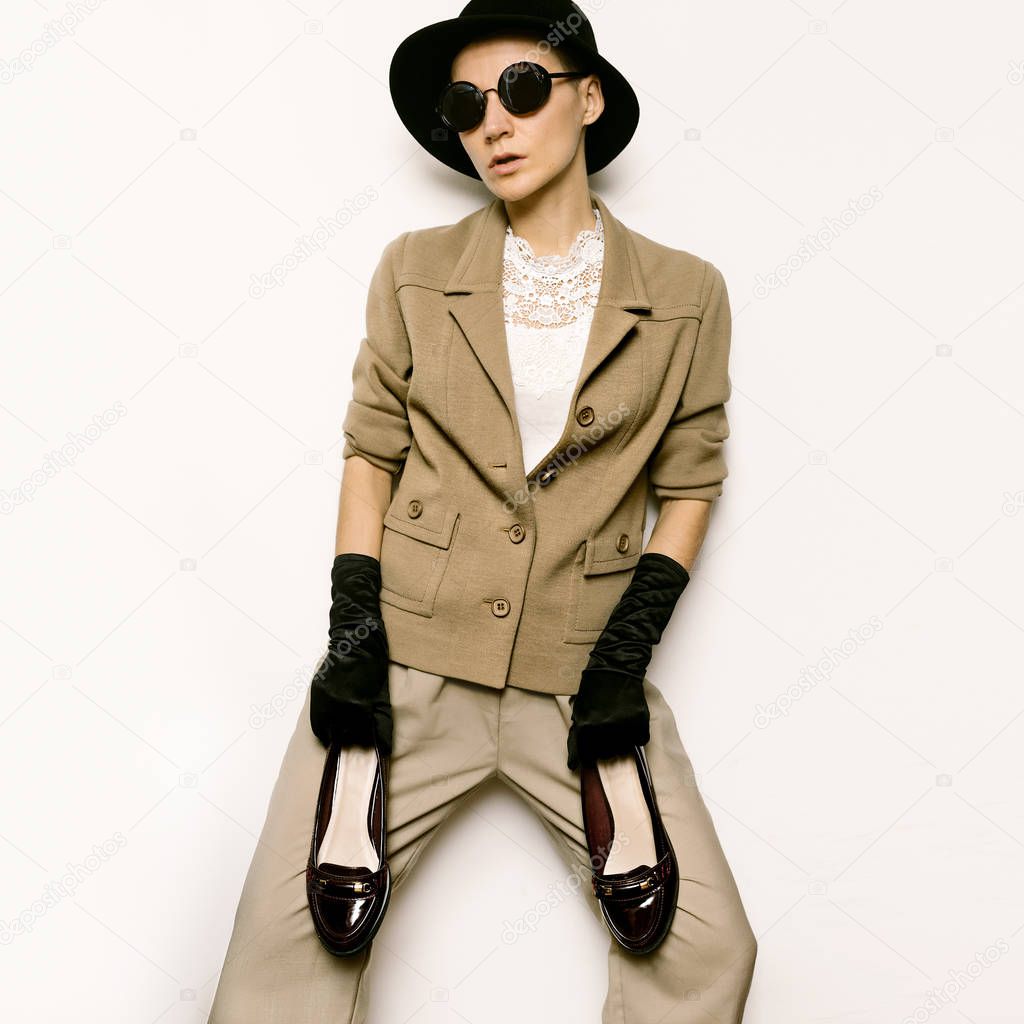 Vintage Fashion Woman. Beige classic costume and stylish Accesso
