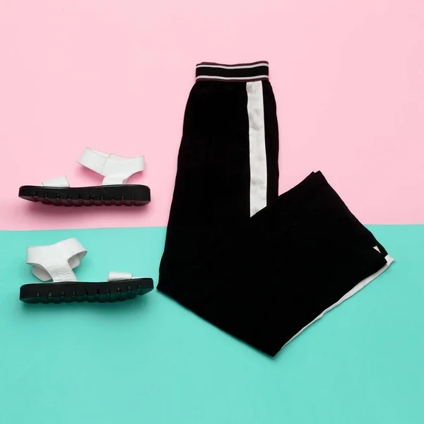 Flat lay fashion set: white sandal shoes with and black pants wi — Stock Photo, Image