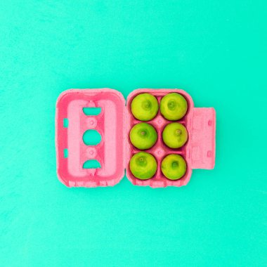 Egg box with limes Minimal design art. Creative Idea clipart