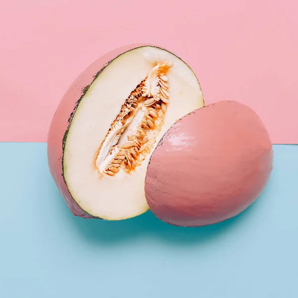 Melon in pink paint. Art gallery Minimal design creative Surreal