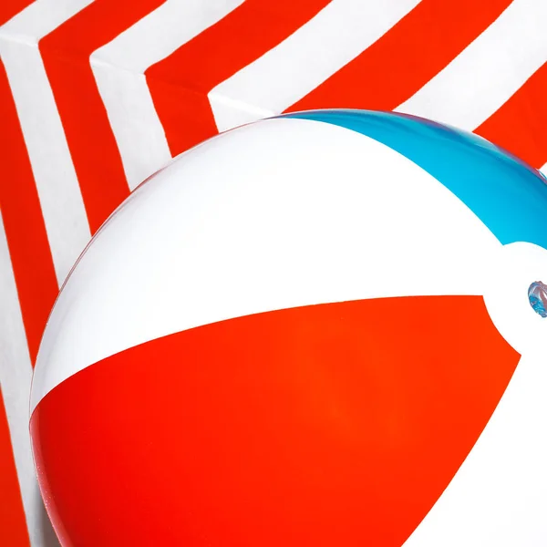 Beach ball on striped background. Minimal — Stock Photo, Image