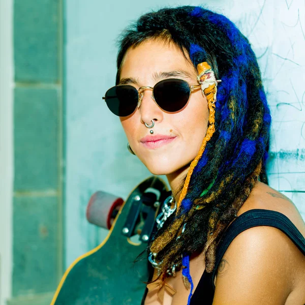 Pretty  Girl Skater with Dreadlocks. Street style — Stock Photo, Image