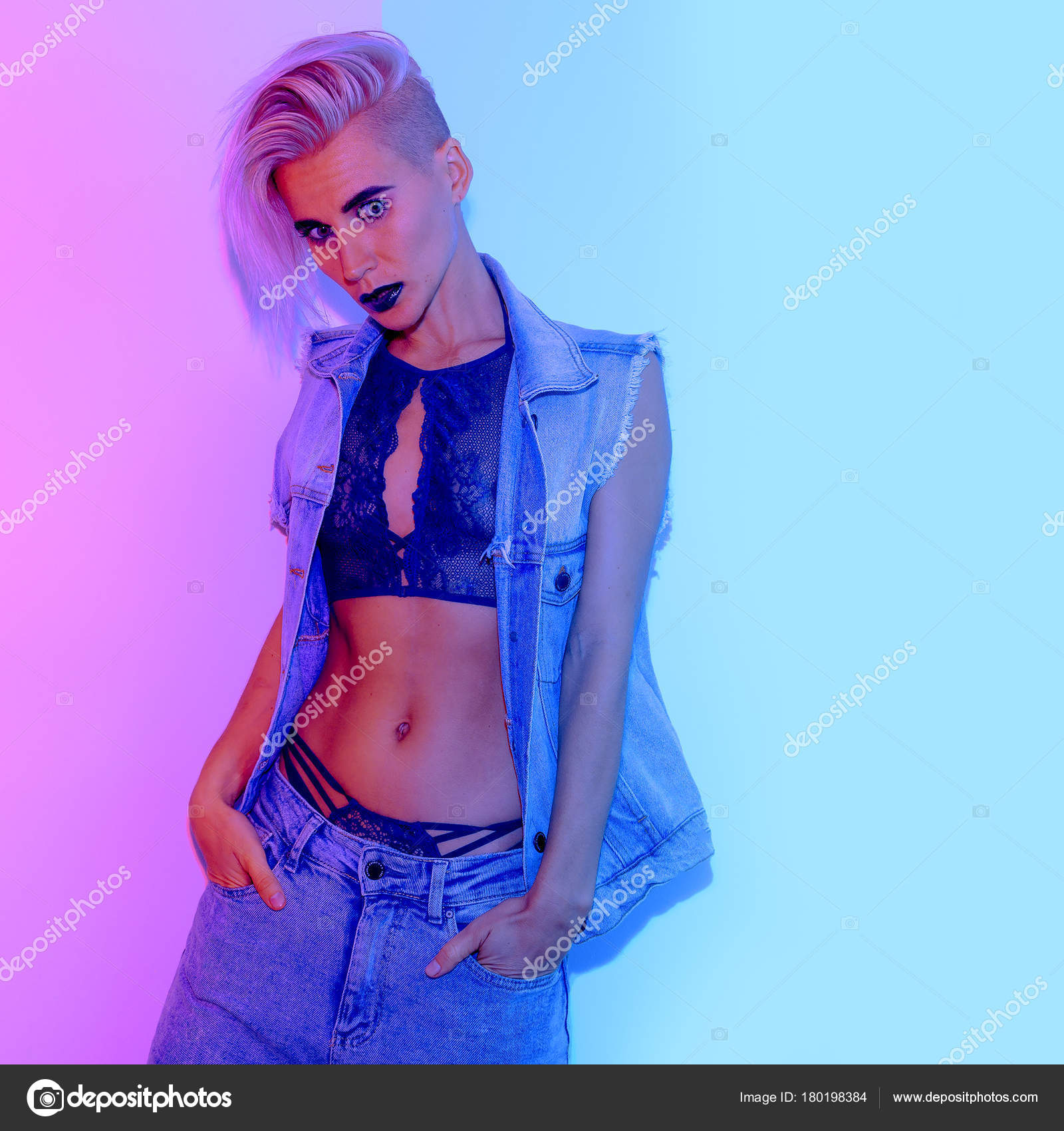 Girl Tomboy style in fashion lace underwear. Neon light Stock Photo by  ©Porechenskaya 180198384