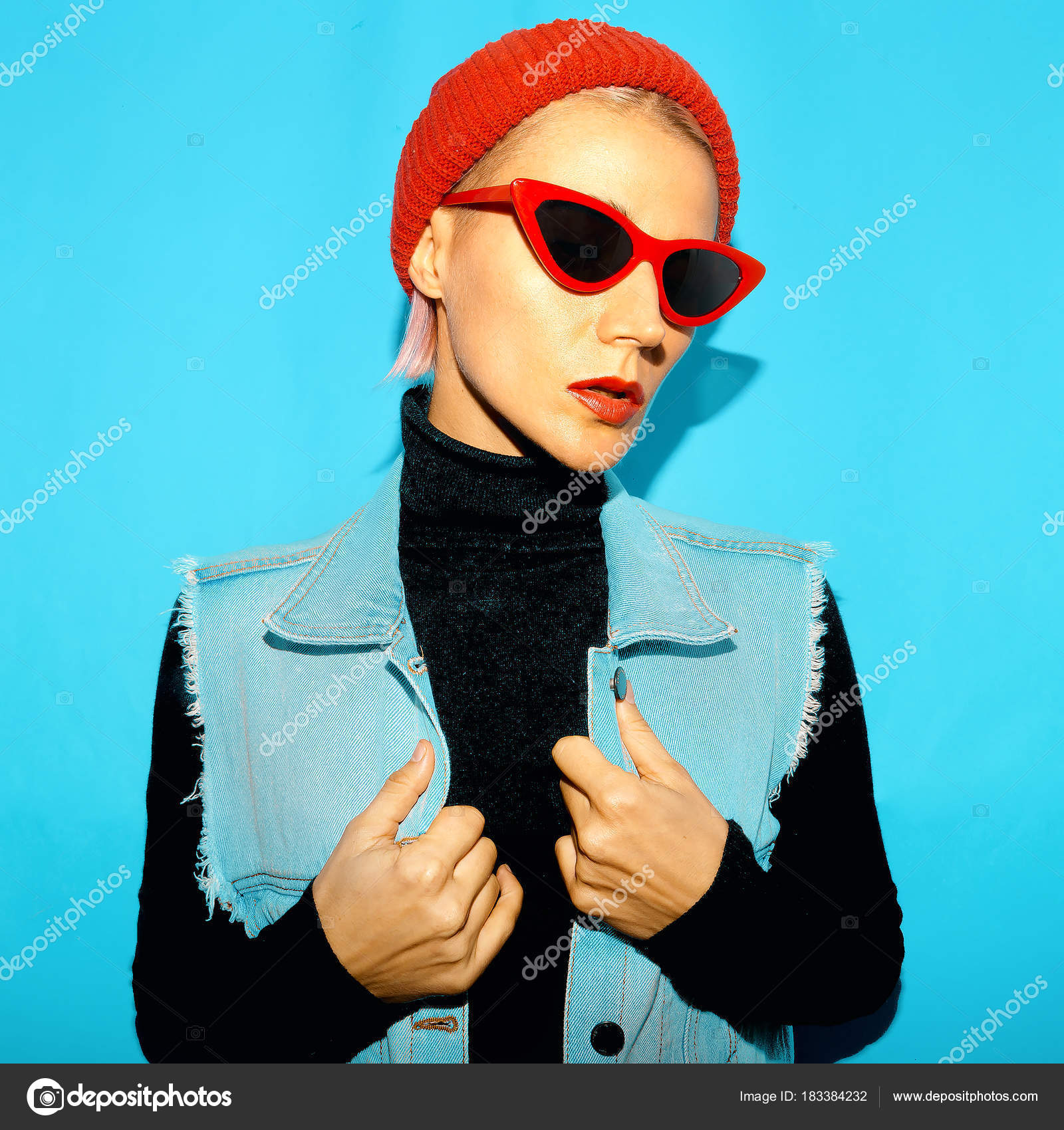 Blonde in fashion clothes and trendy Accessories. Beanie and red ...