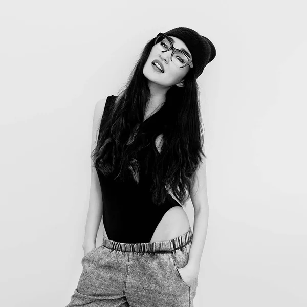 Brunette Girl In Black Body And Beanie Cap Jeans Tomboy Style Stock Photo Image By C Porechenskaya 189004898