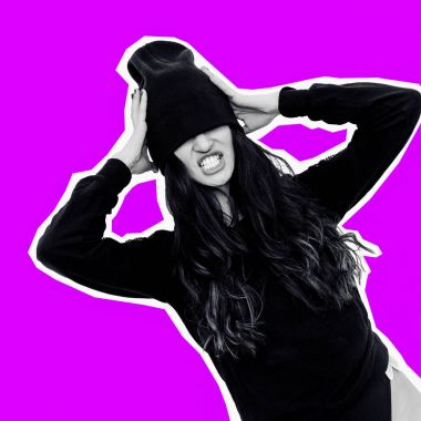 Brunette Model in black clothing and beanie cap. Fashion Tomboy  clipart